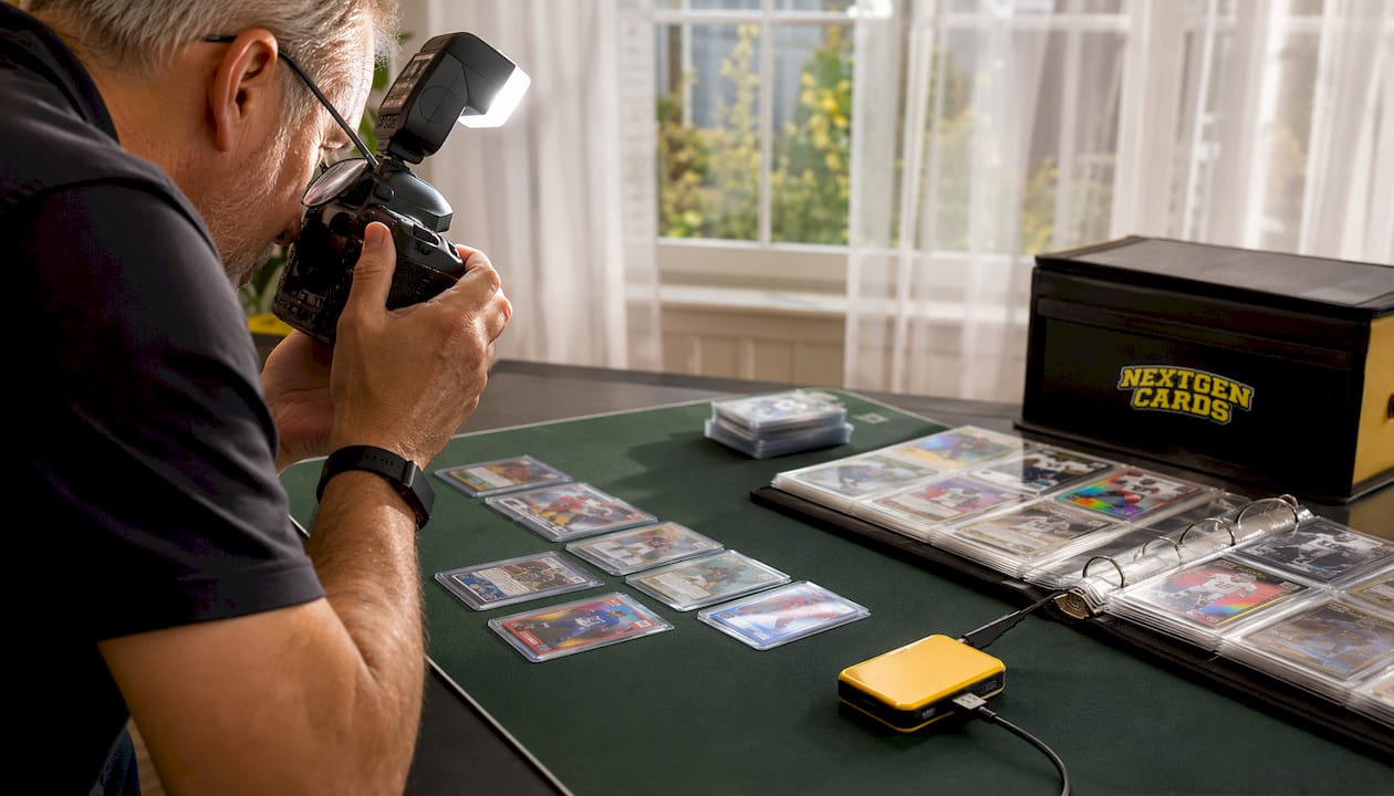 Hands photographing cards for insurance documentation