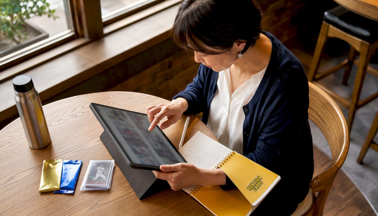Collector using digital card catalog on tablet