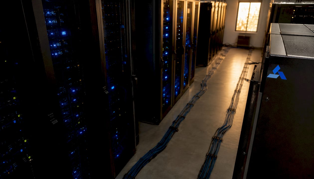 secure server room with Blue Prysm logo and data equipment