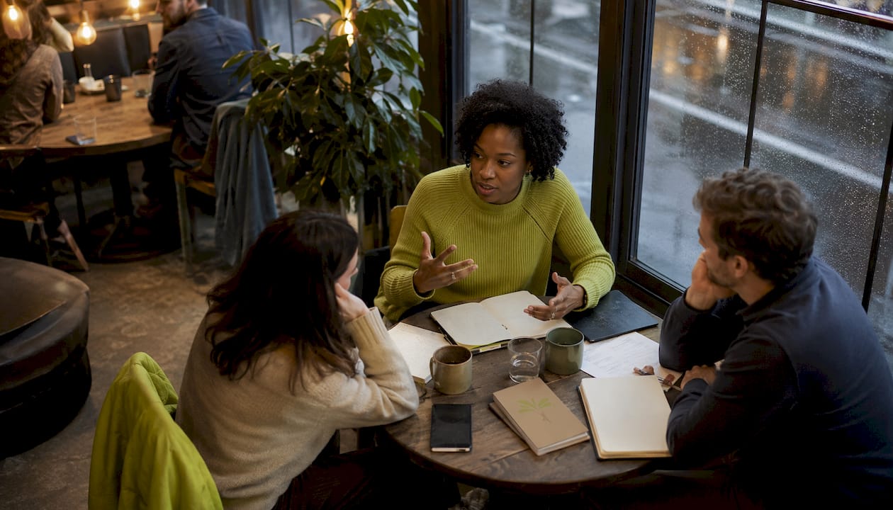 Diverse team meeting showing stress