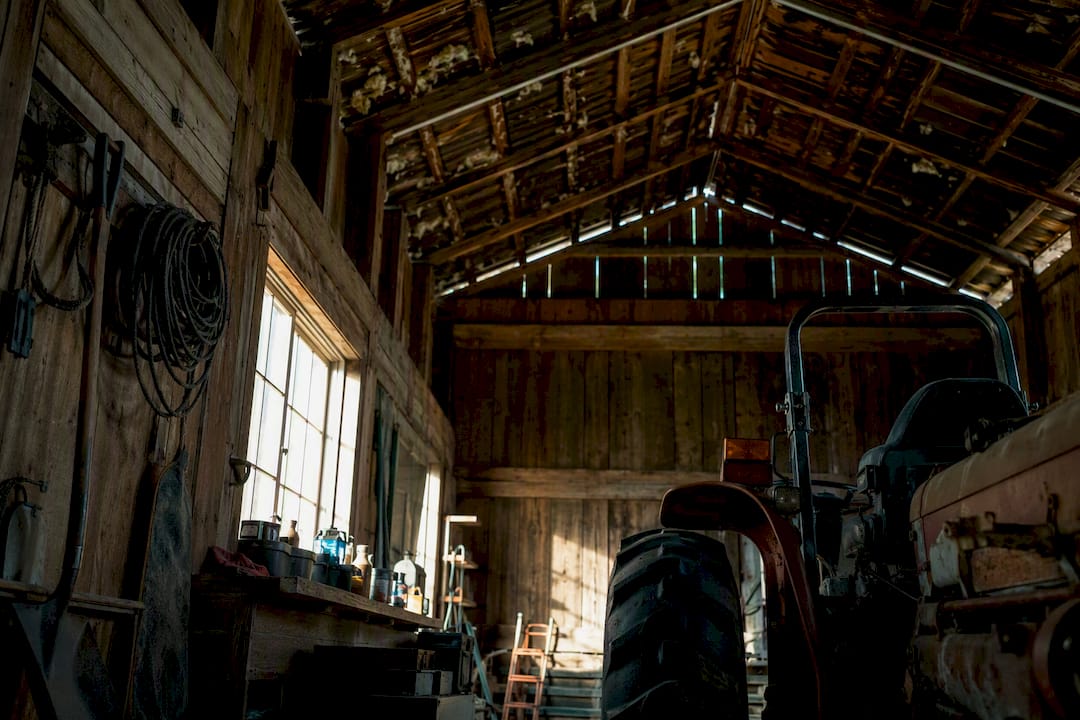 Ventilated tractor shed interior with vents and tractor parts