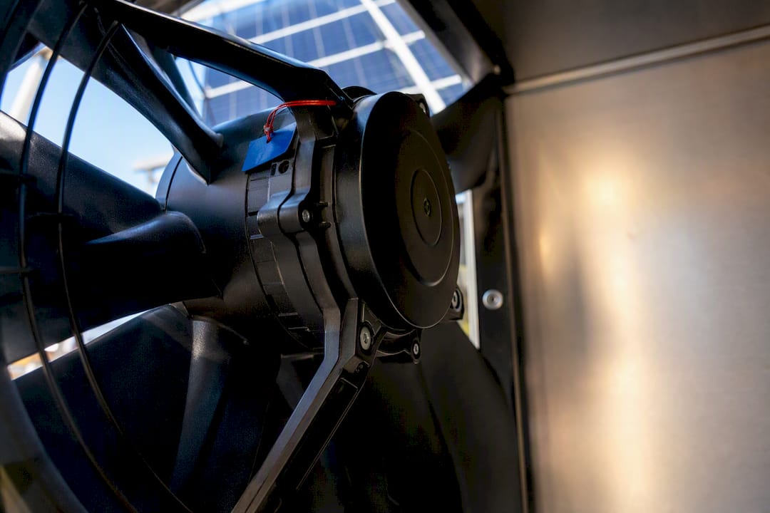 Close-up of brushless fan motor in solar enclosure