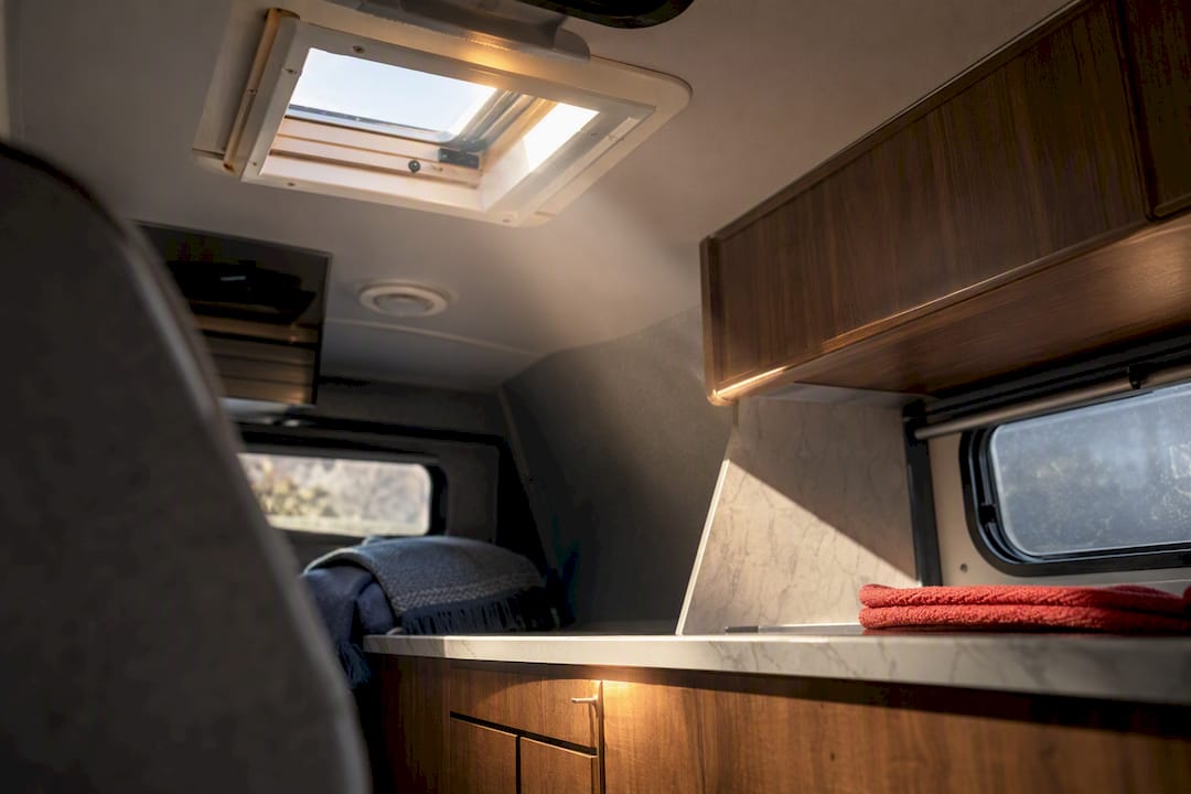 Sunlit RV interior with roof ventilation opening