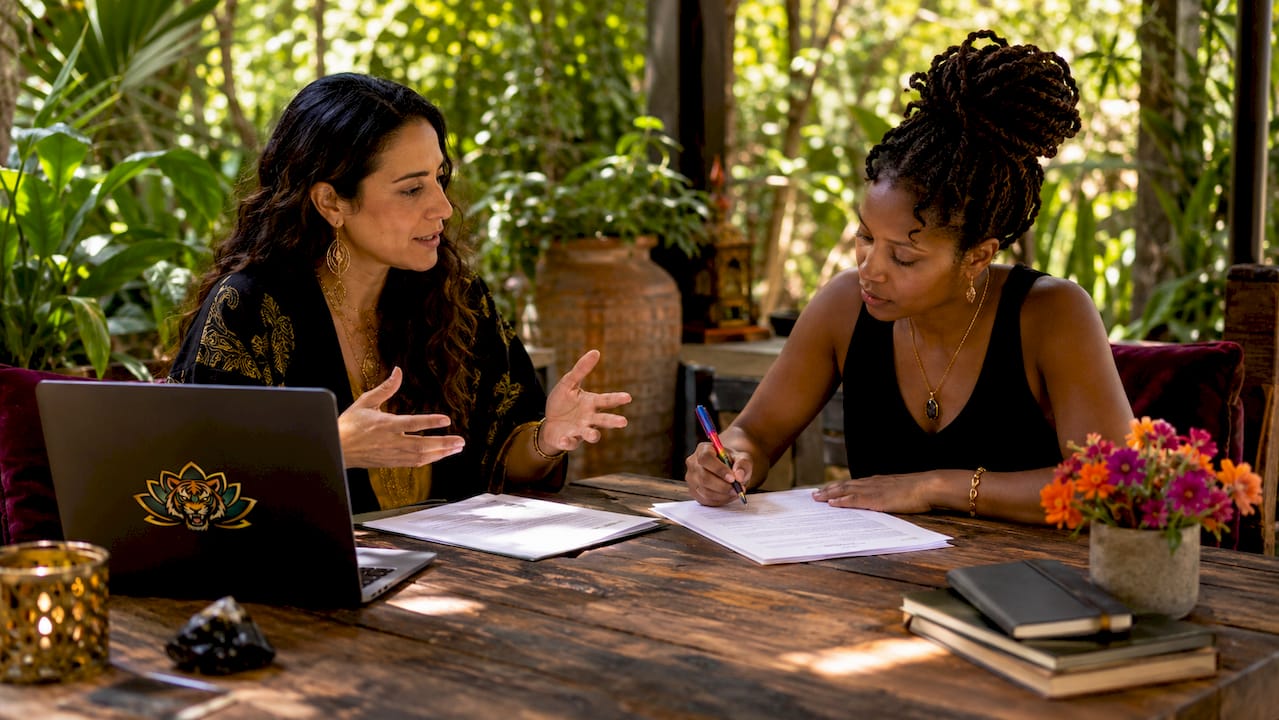 Editor and writer collaborating over manuscript