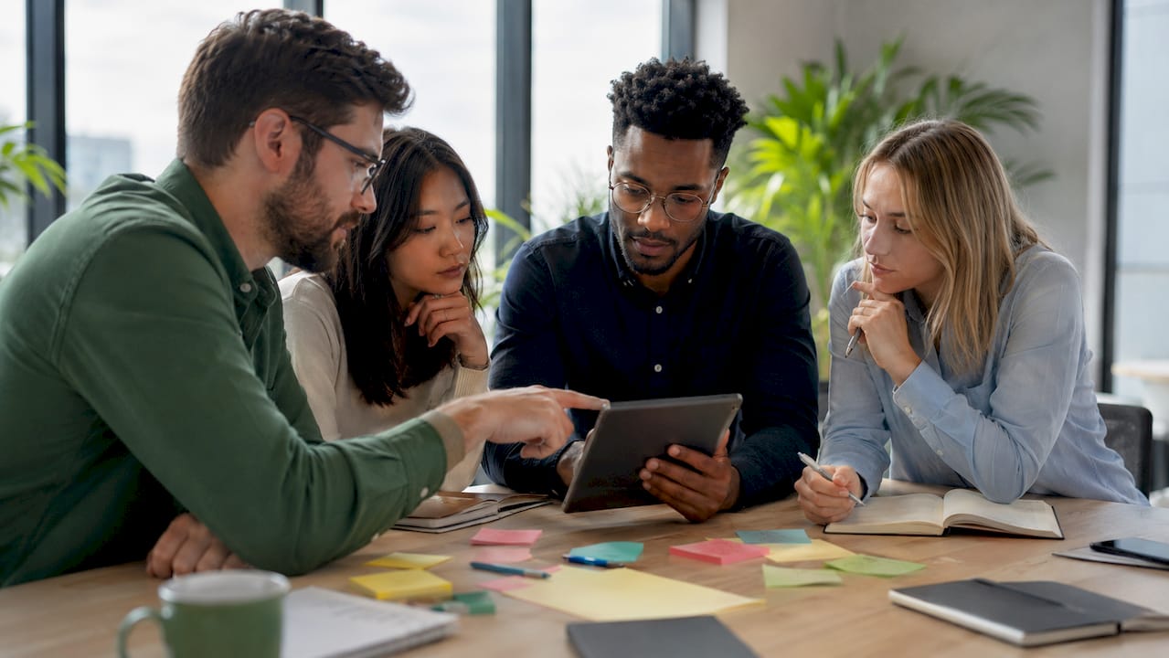 Team collaborating on crypto governance model in meeting room