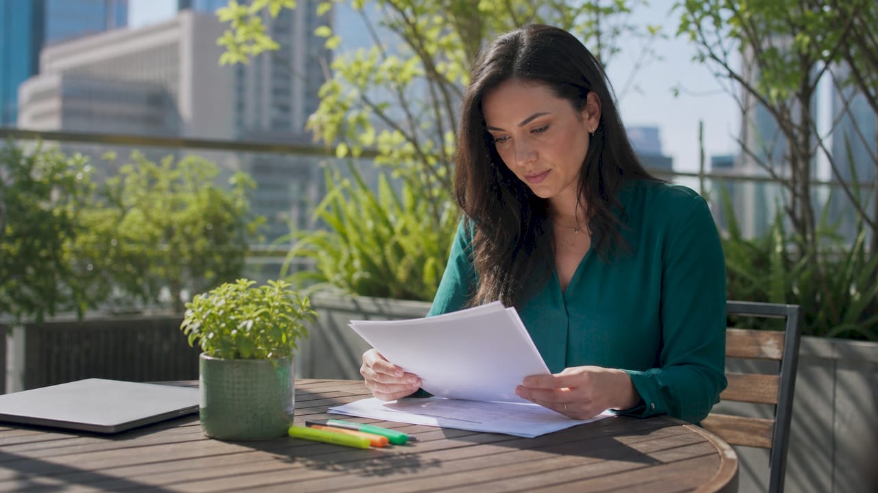 Compliance officer reviewing regulatory documents