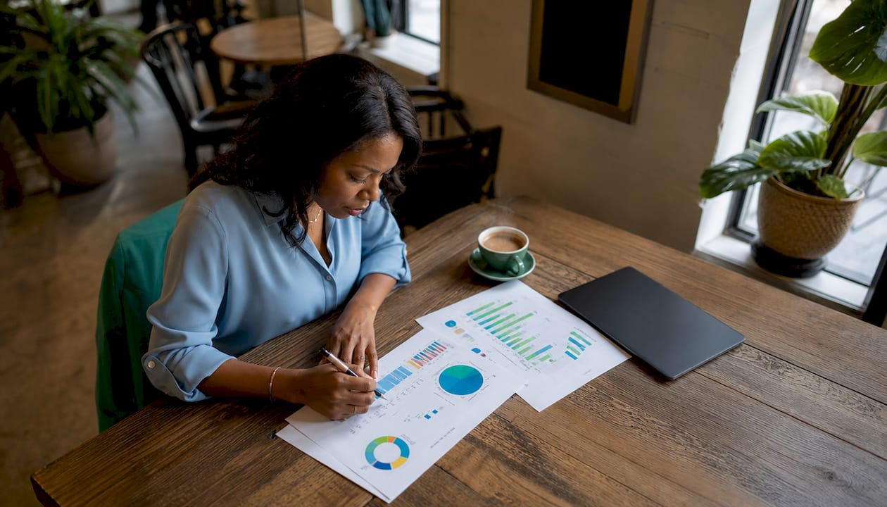 Woman reviewing digital asset management reports