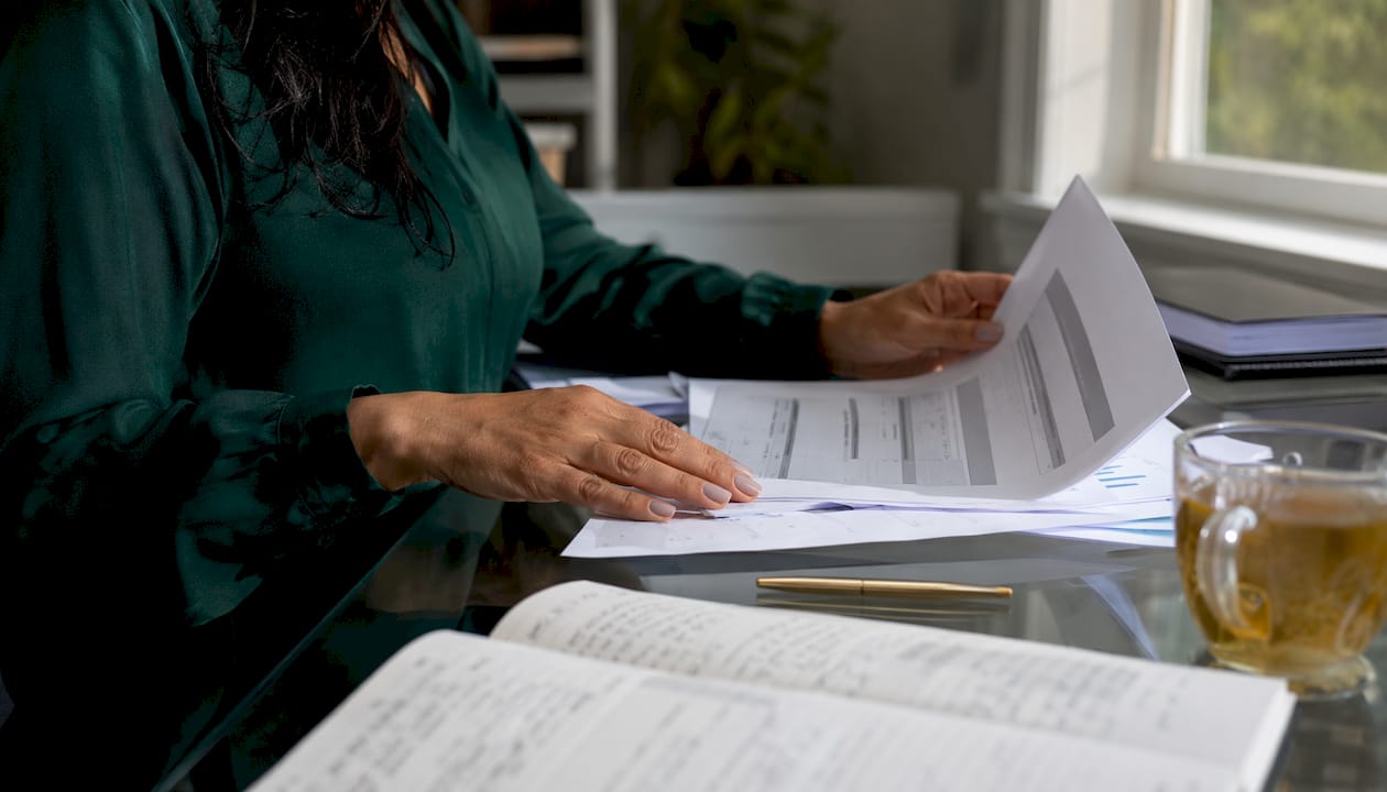 Hands sorting custody legal documents