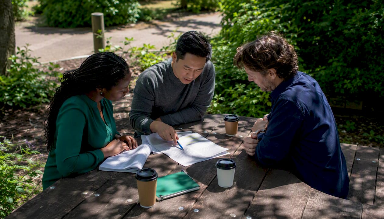 Compliance team reviewing digital asset legal documents