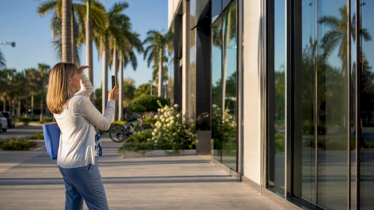 Tenant inspecting clean building facade outdoors