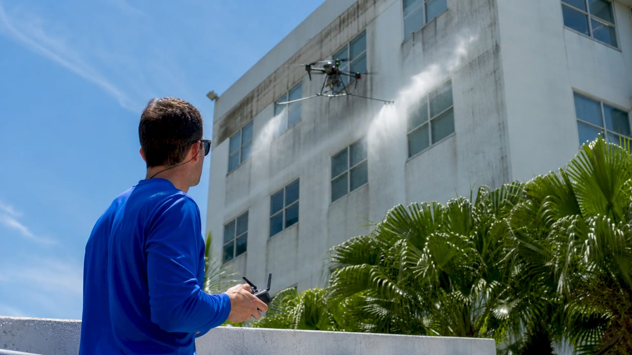 Drone performing eco-friendly building exterior cleaning