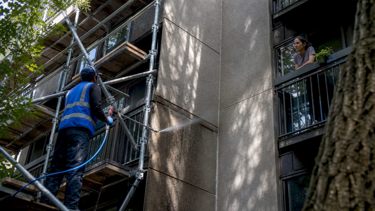 Scaffolding and pressure washing at condo facade