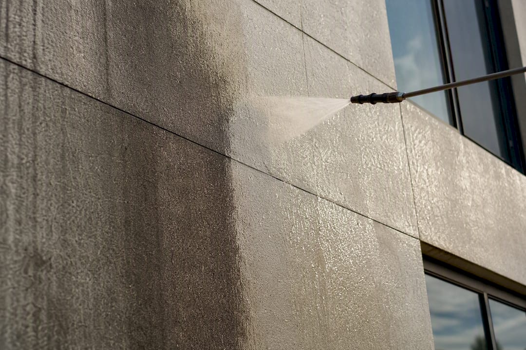 Soft-wash cleaning on condo building facade