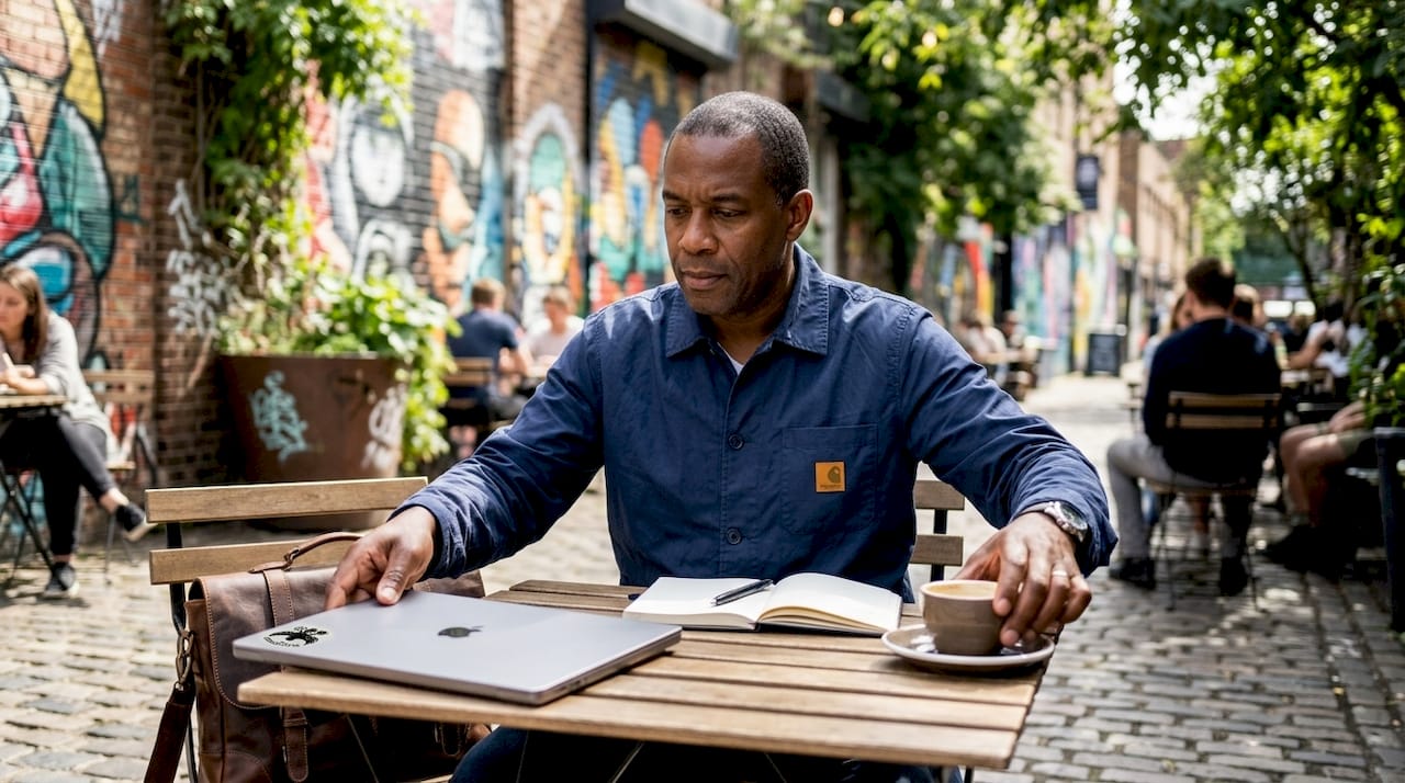 Man arranging table space in cafe