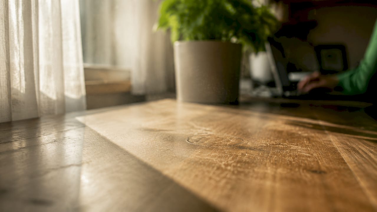 Dust particles settling on surface near ionizer