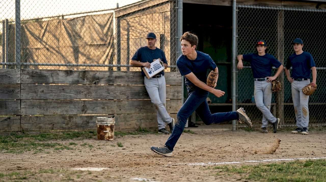 Teen pitcher demonstrates pitching stride technique