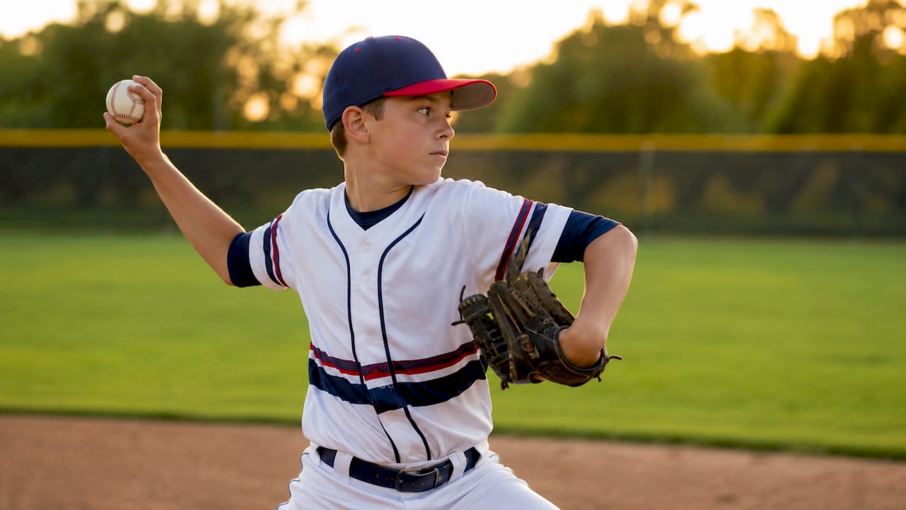 Close-up of young pitcher's arm in motion