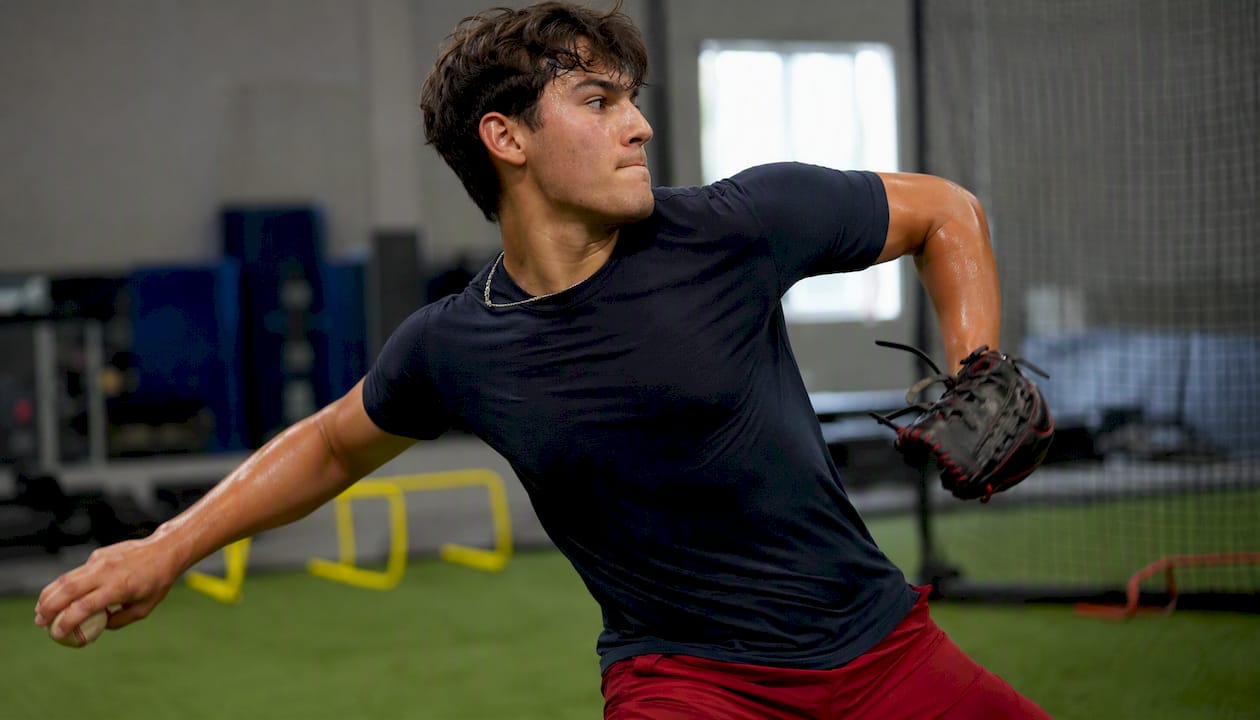 Youth athlete executing pitching kinetic chain drill