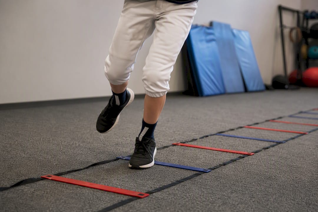 Youth baseball footwork ladder drill close-up