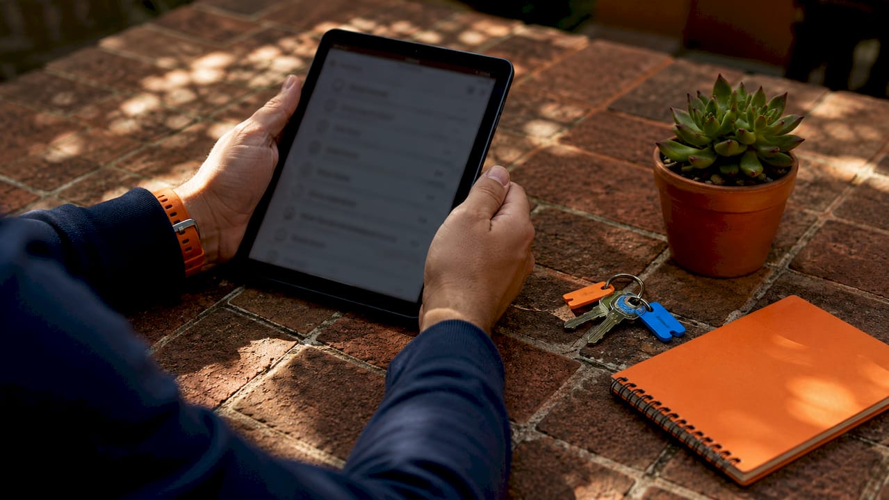 Hands holding tablet with rental maintenance checklist