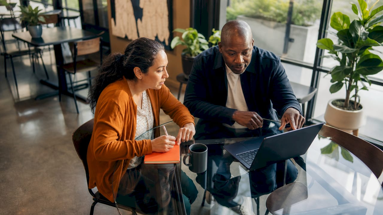 Property managers discussing hybrid model