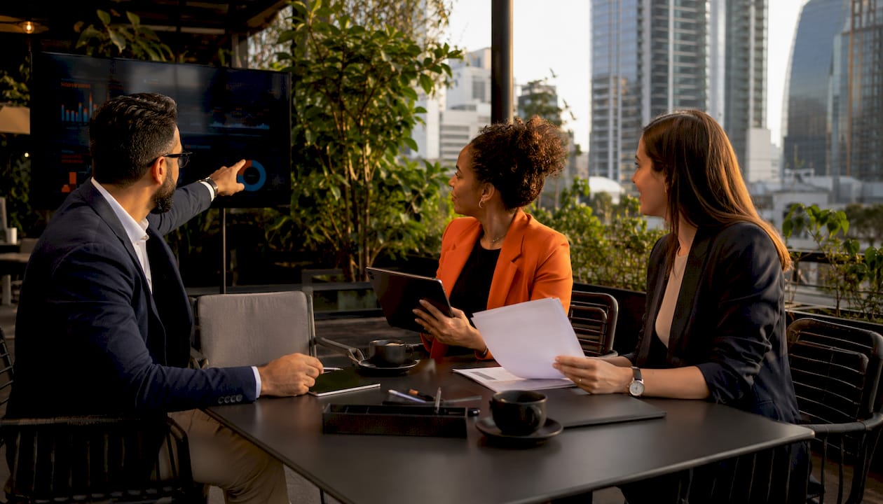 Team discussing automated sync in modern office