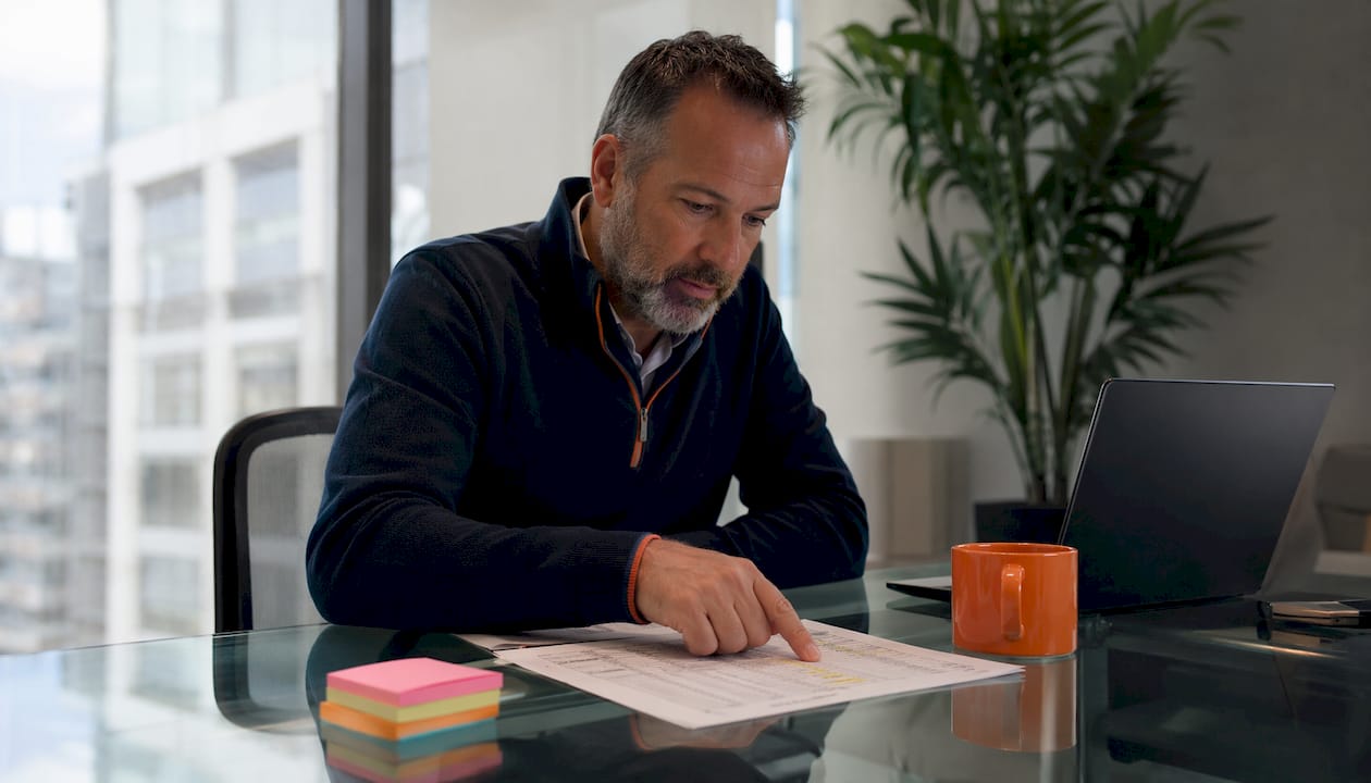 Property manager reviewing maintenance summary sheet