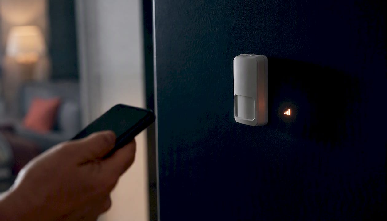 Close-up of wall-mounted sensor device at property