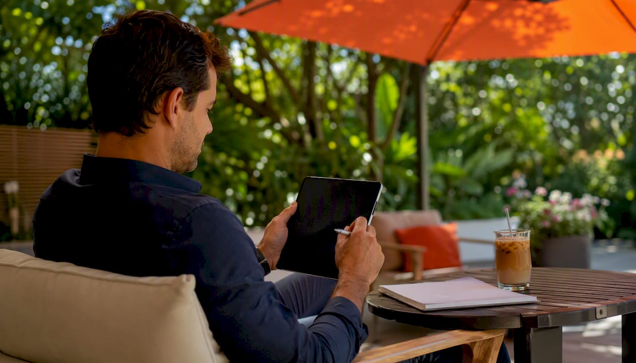 Manager's hand adjusting tablet pricing settings