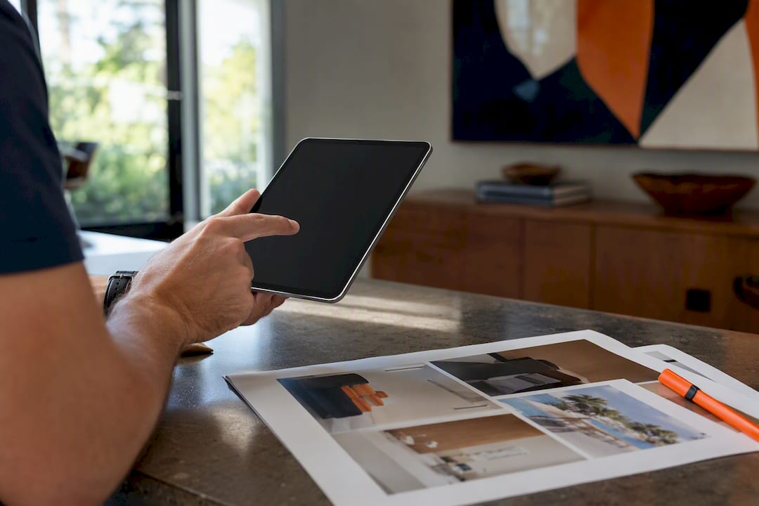 Hand selecting vendor from catalog on tablet