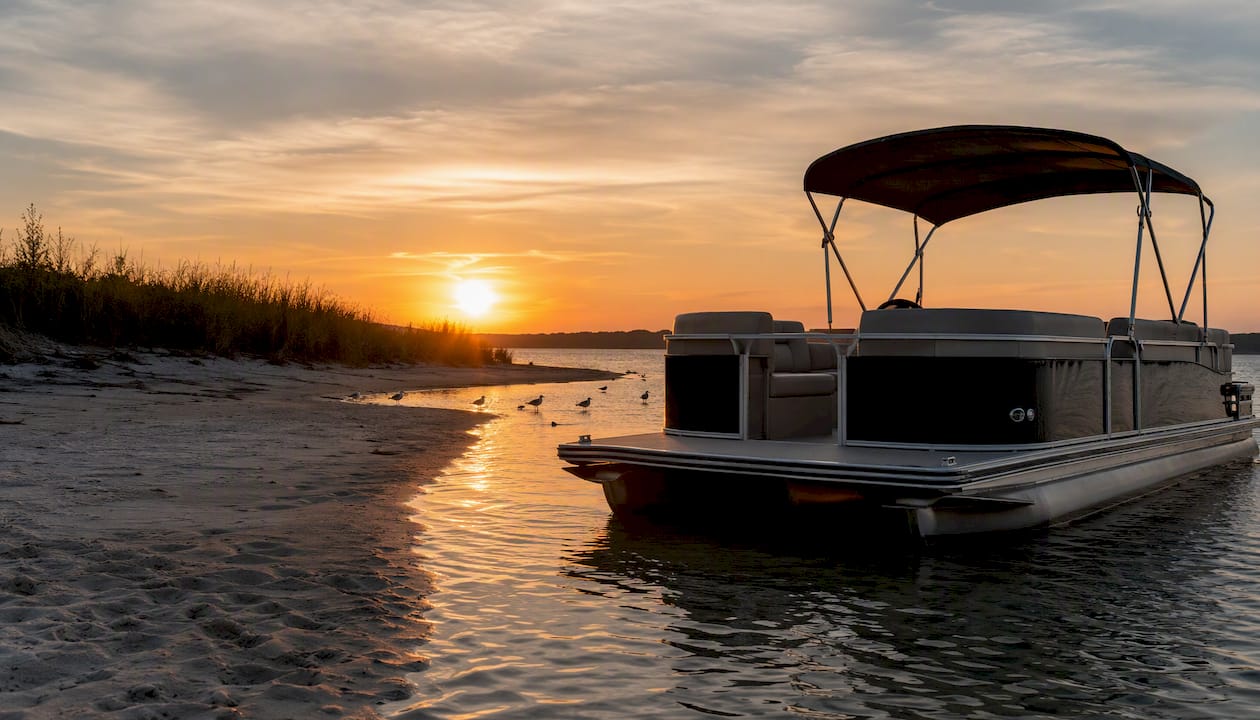Pontoon boat anchored at sandbar
