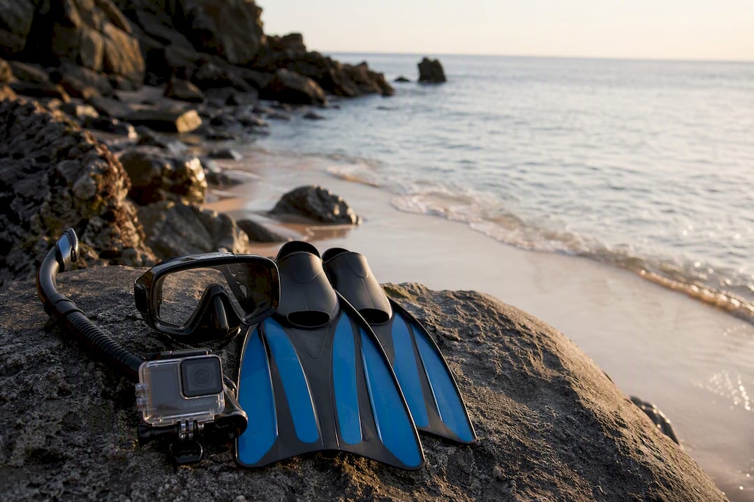 Snorkeling gear on rock at tropical beach