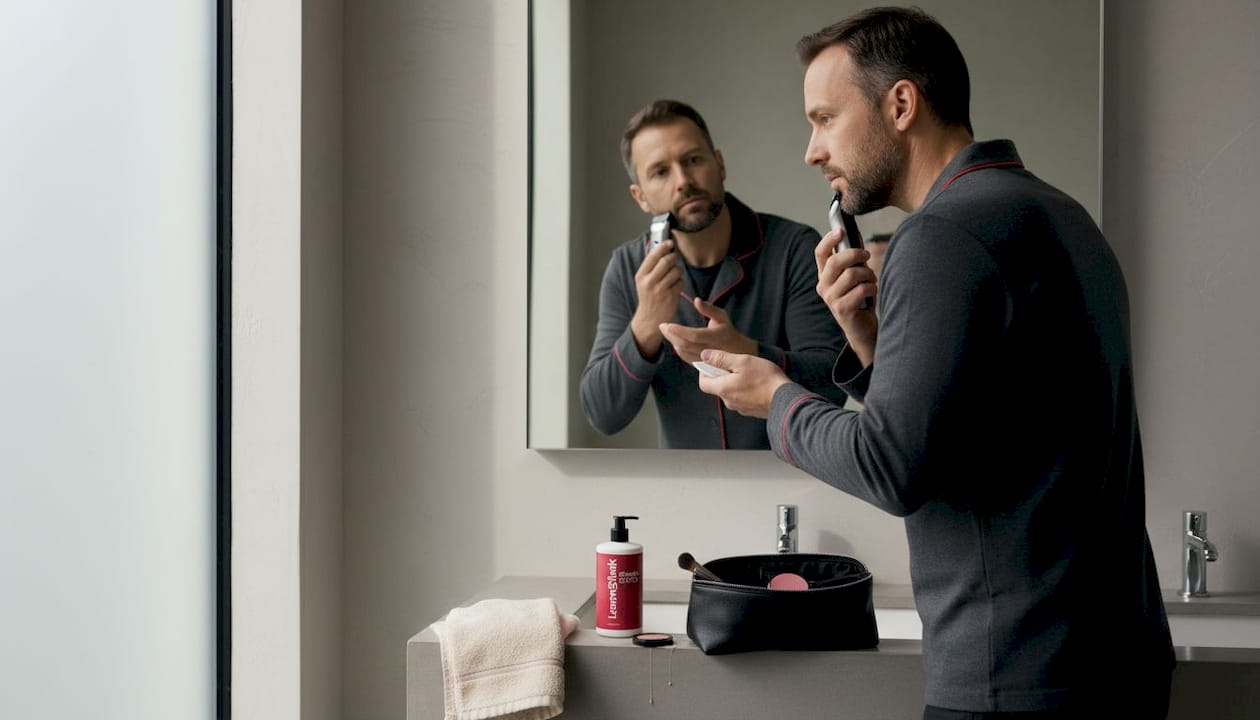 Man grooming and applying makeup for headshots