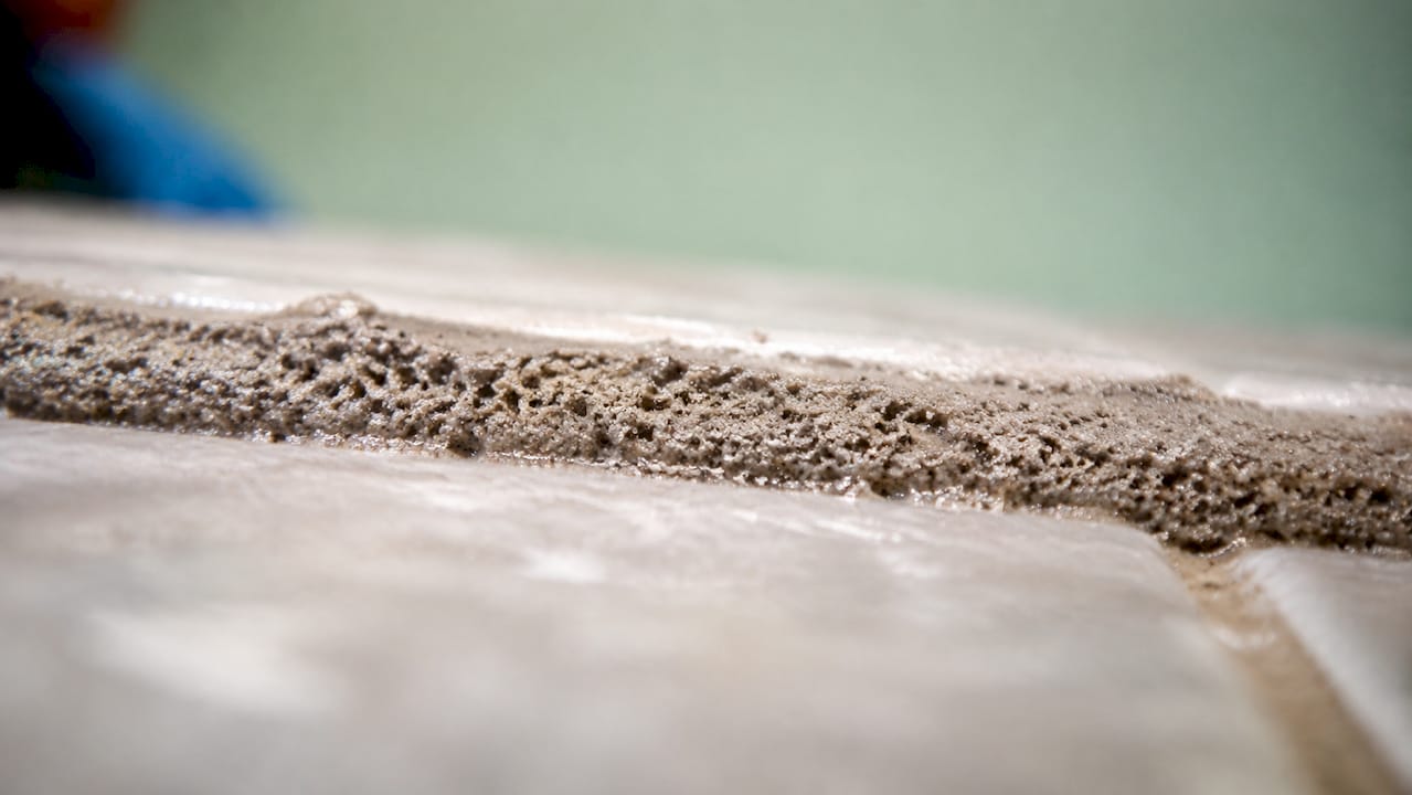 Close-up of porous tile grout texture