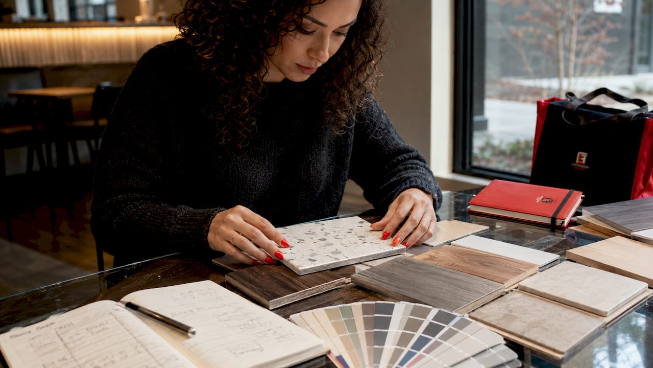 Designer reviewing flooring material samples