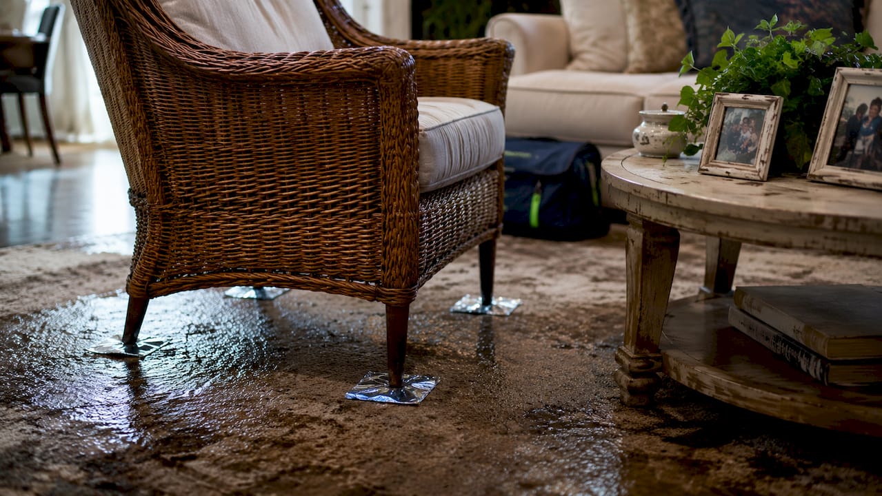 Furniture legs elevated on foil to protect carpet