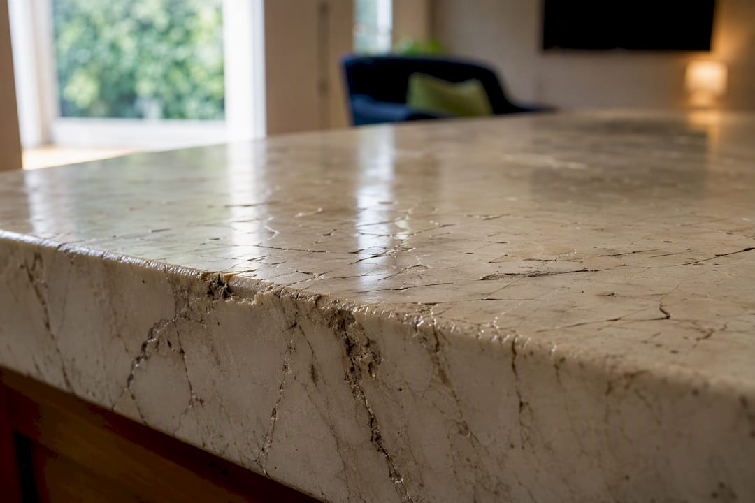 Close-up of cracked and chipped marble countertop