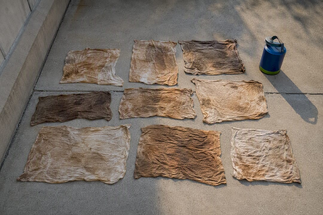 Finish rags drying beside metal safety can