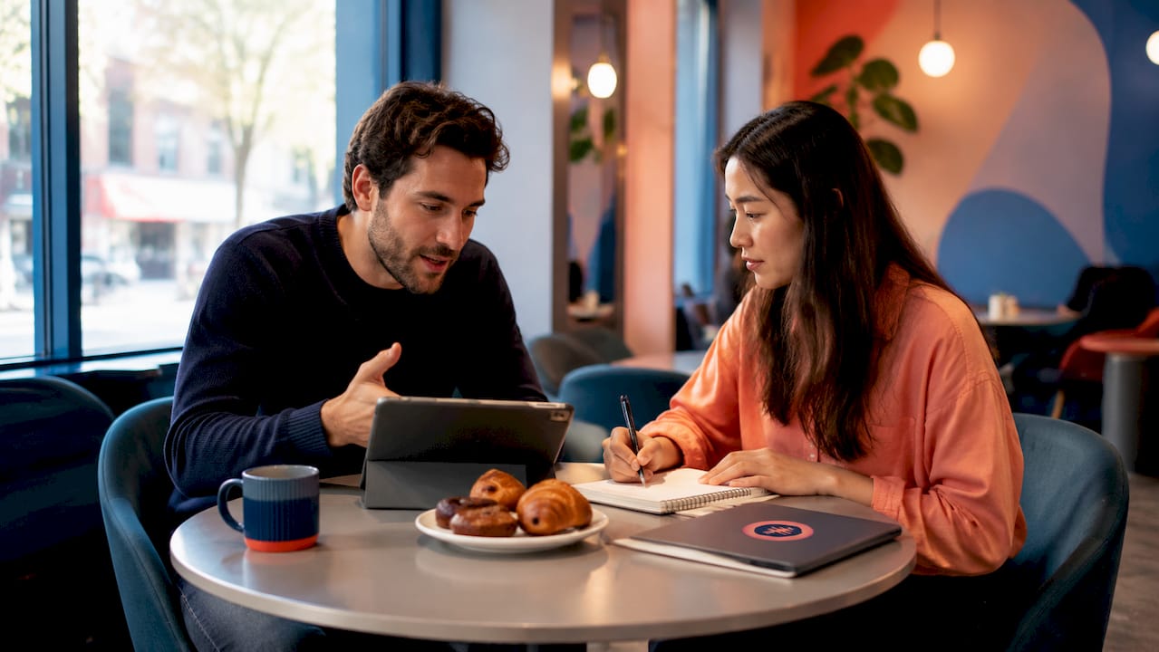 Two designers discussing client feedback