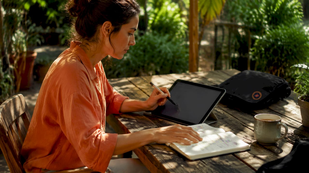 Hands interacting with tablet for feedback