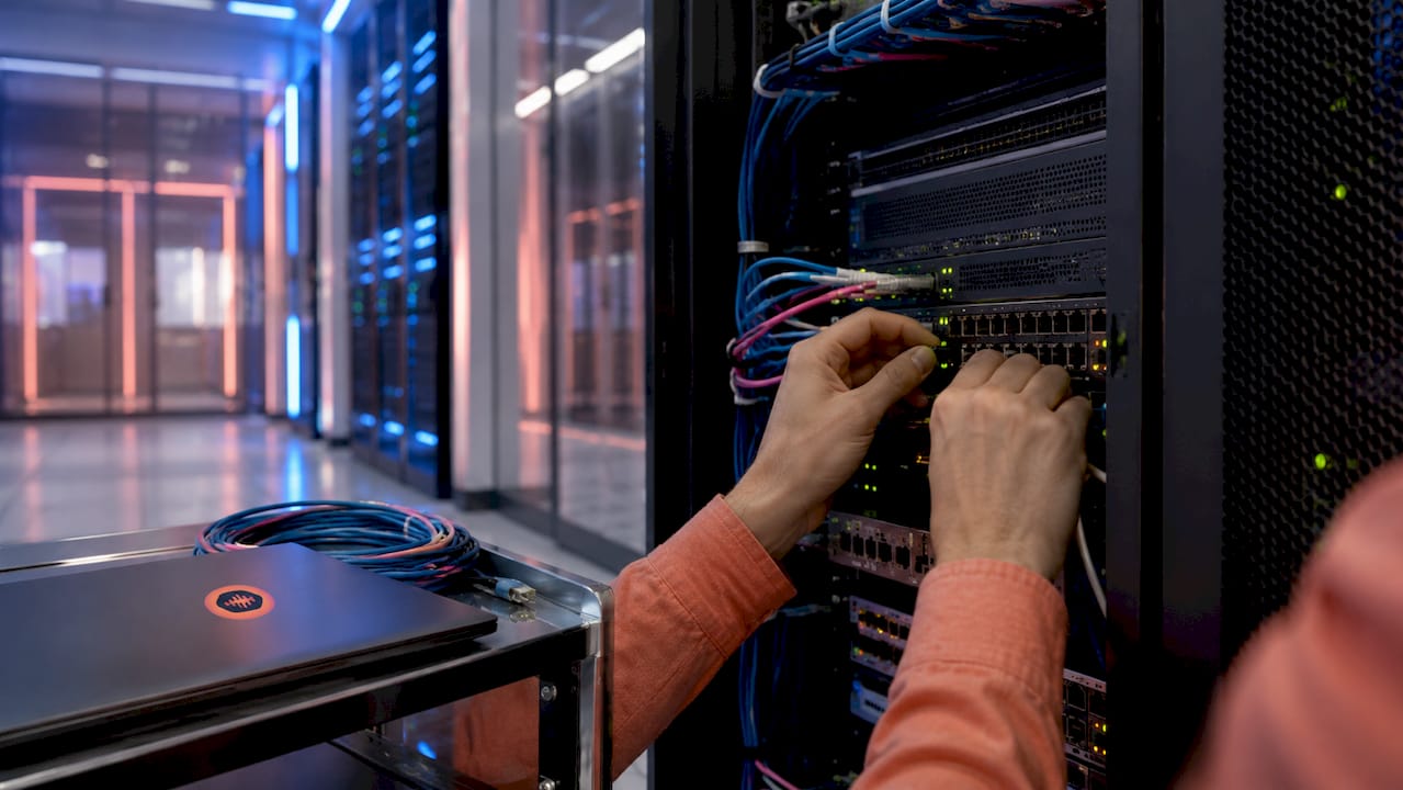 Hands managing paywall technical equipment