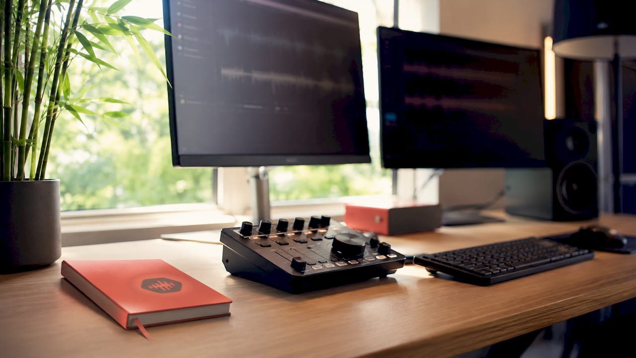 Home studio desk with audio collaboration equipment