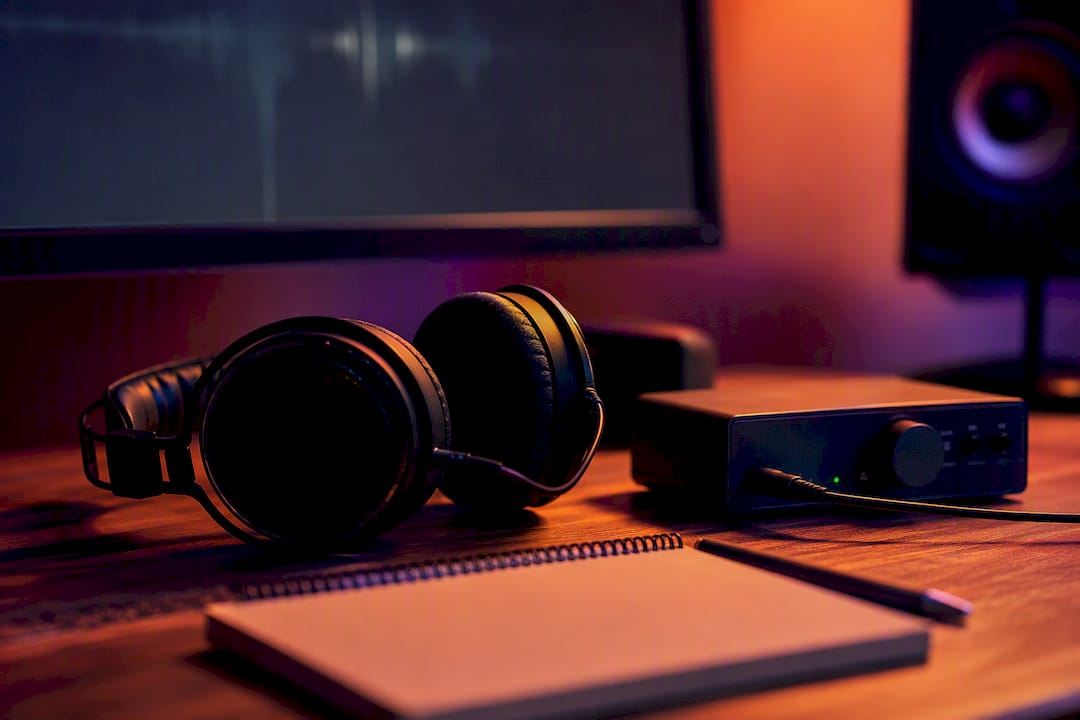 Audio workstation with headphones and waveform display