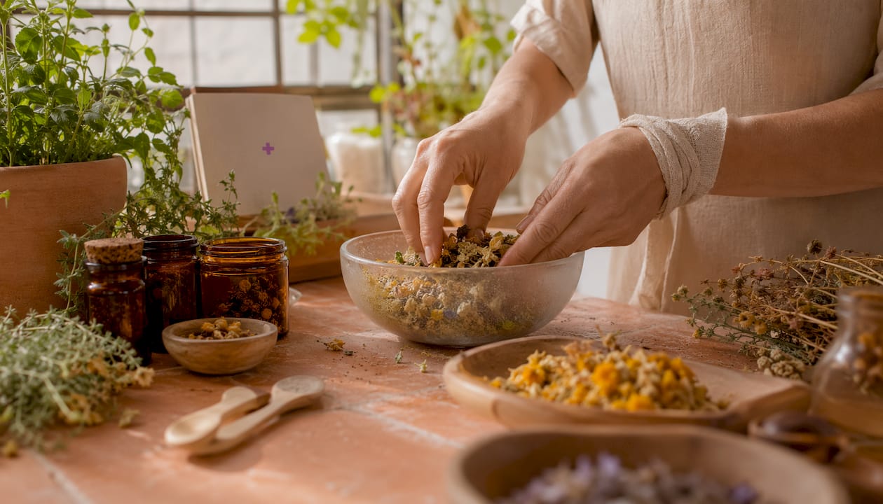Hands mixing natural ingredients in artisan skincare