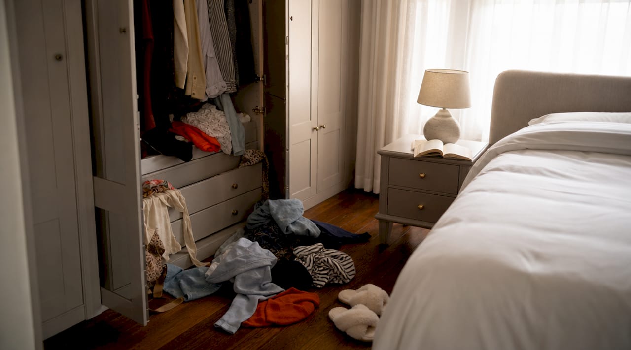 Overhead view of cluttered bedroom corner