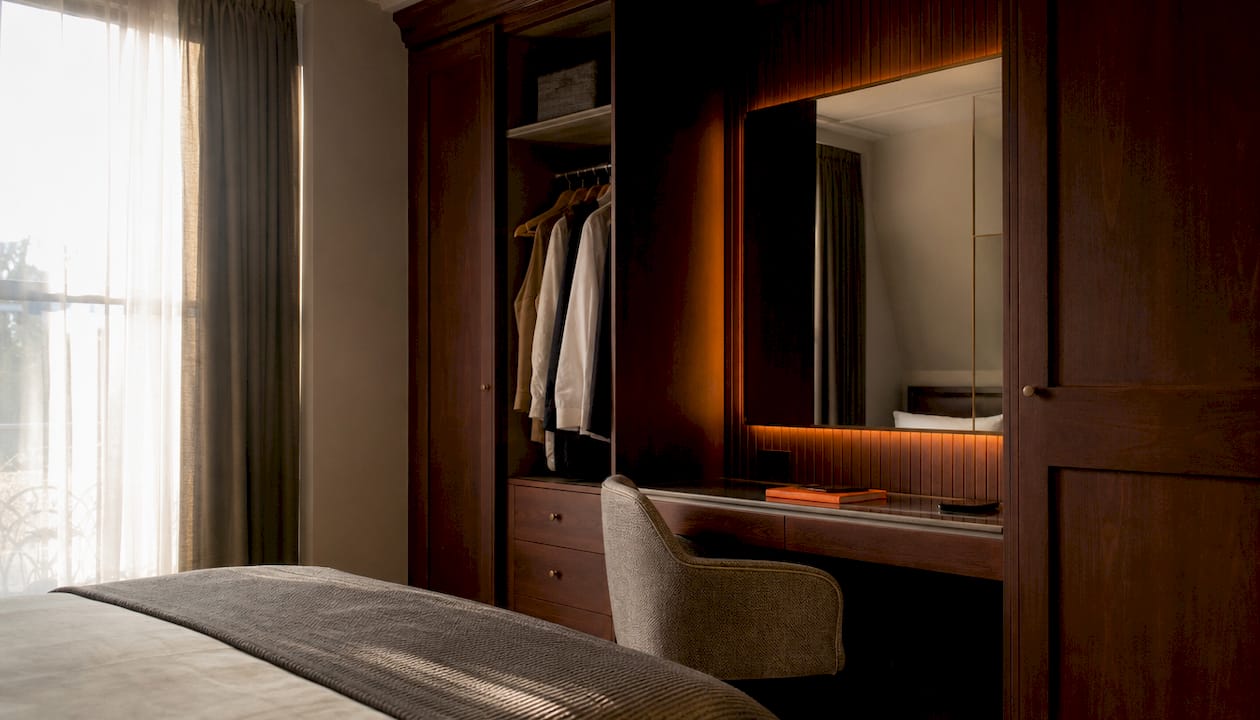 Modern shaker style fitted wardrobe interior with dressing table
