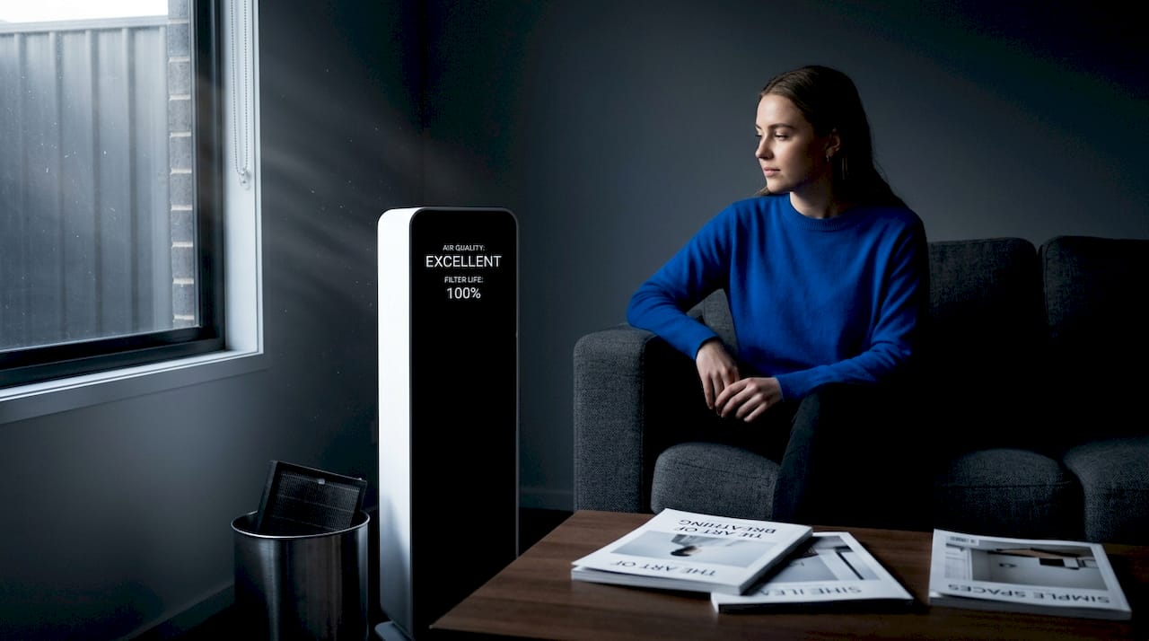 Woman checks air quality after filter change