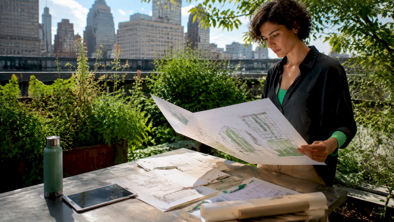 Architect studying diagnostic visualization printout