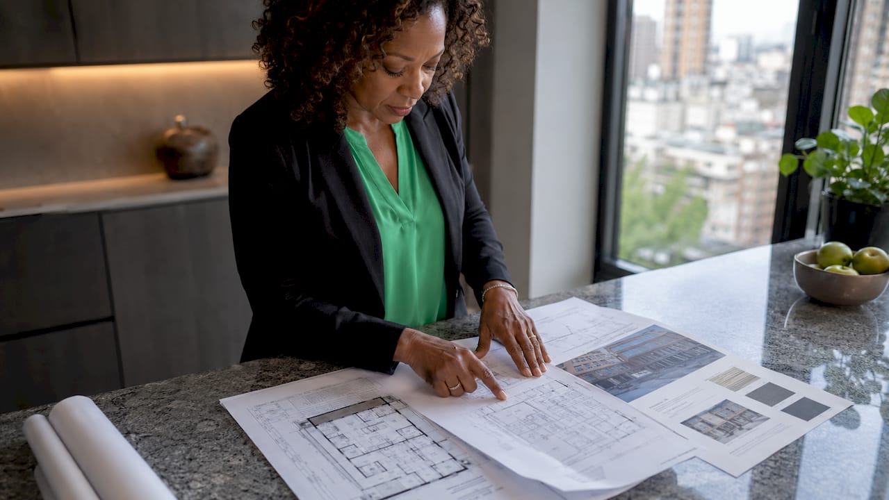 Architect reviewing diversity certification papers
