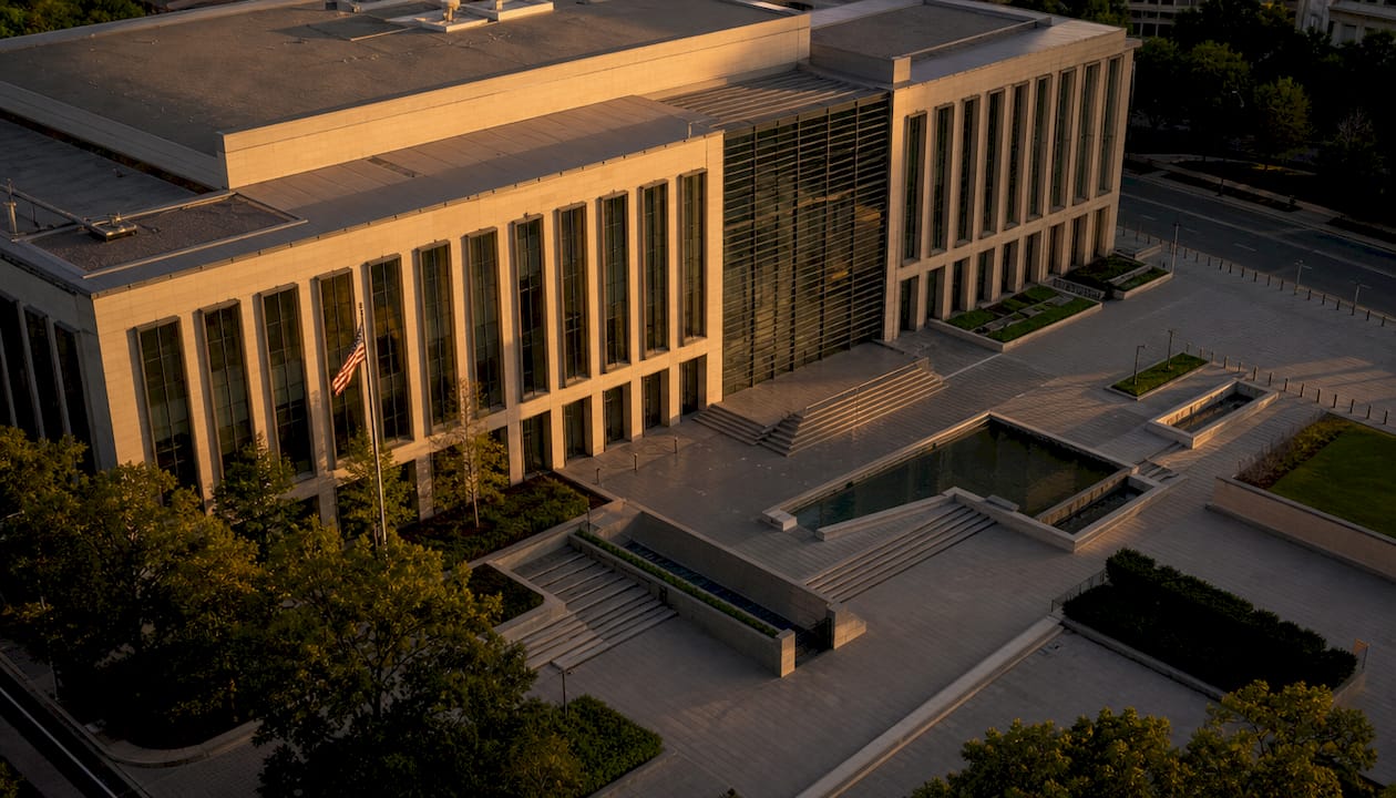 Exterior elevation of federal building at dusk
